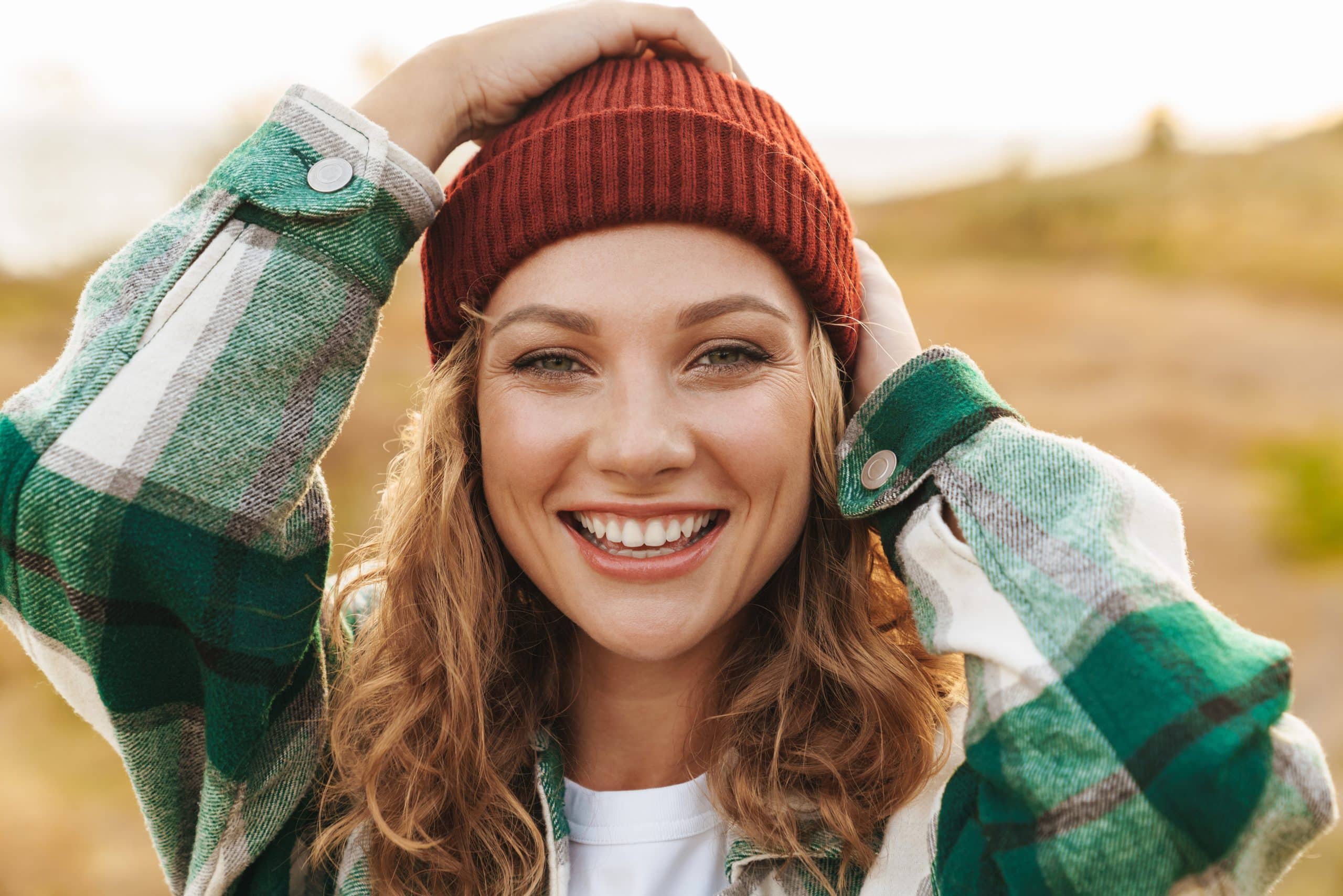 woman with beanie smiling - Prosper Dental Studio