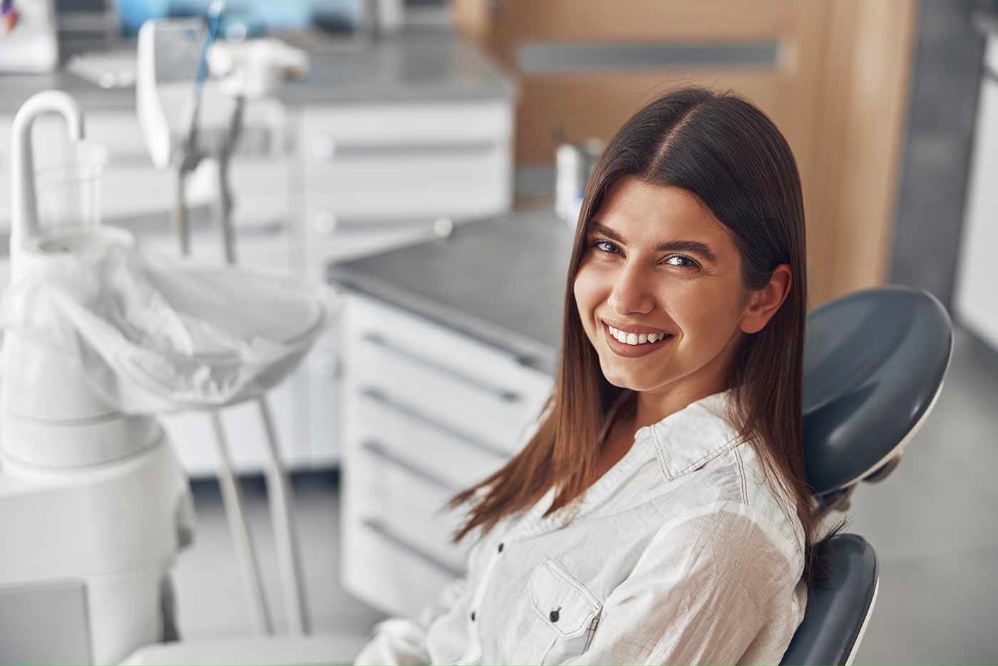 woman during cosmetic dental treatment at prosper dental studio