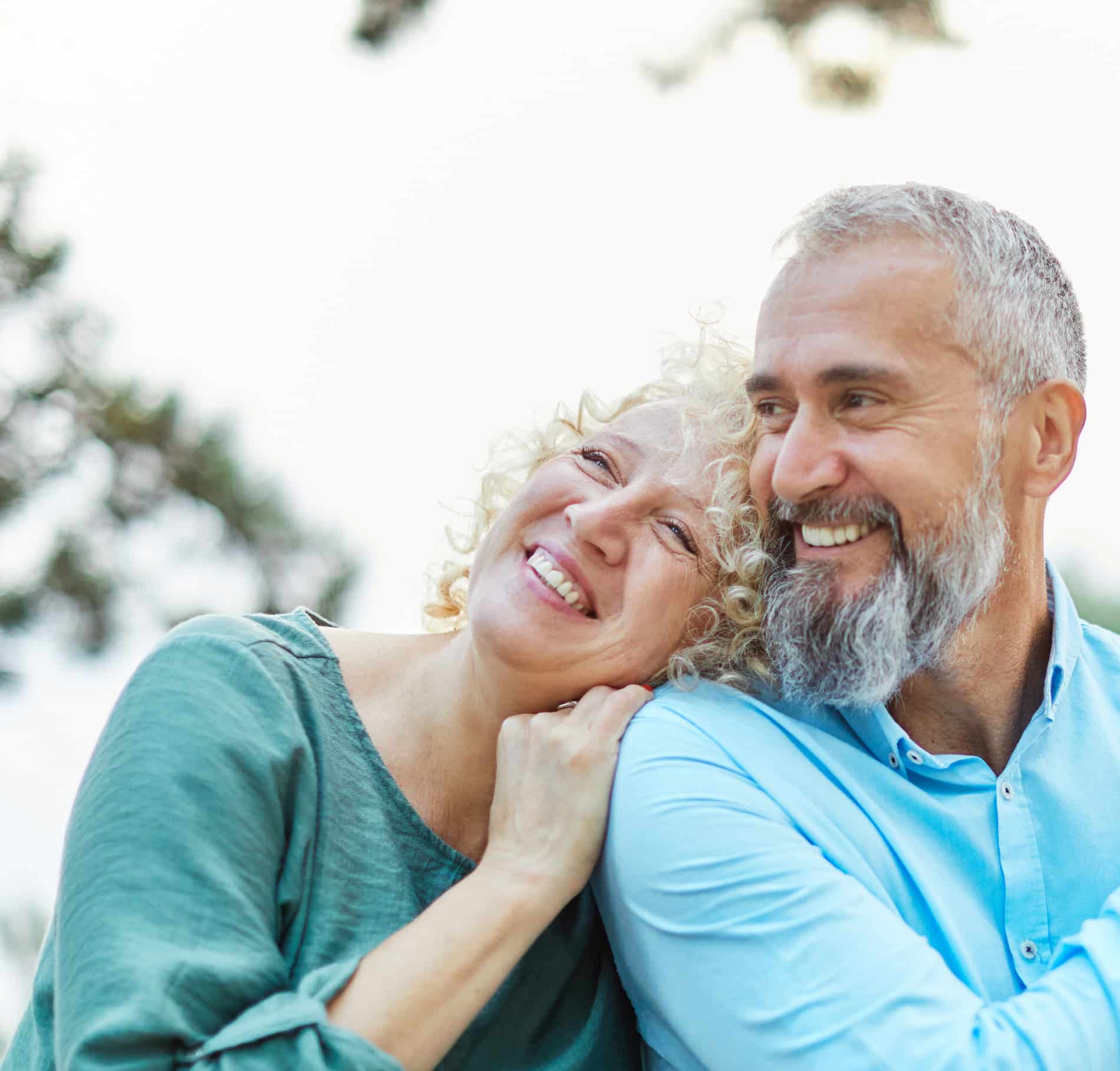 A man and woman embracing after an oral exam in Cornelius NC