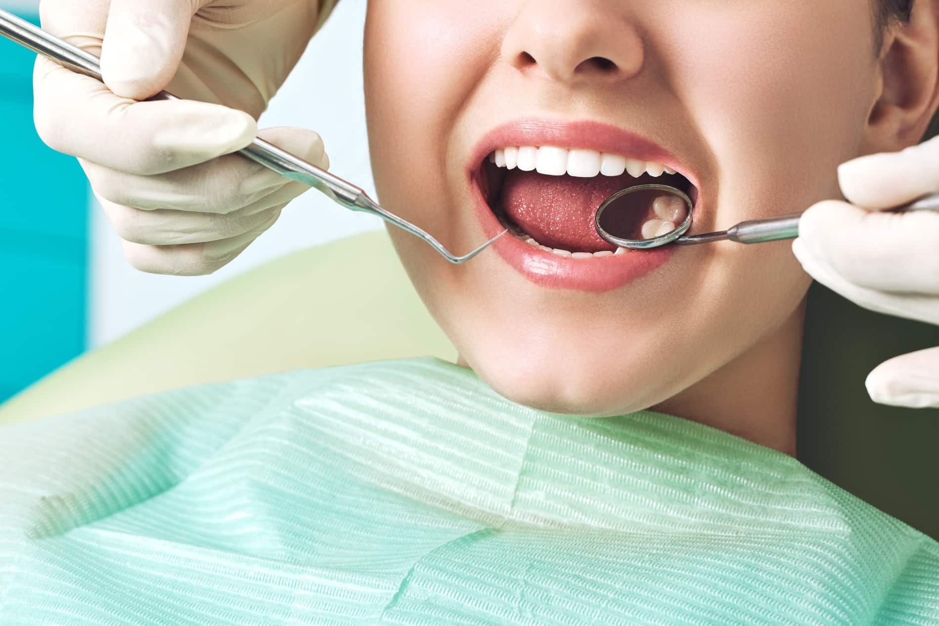 Woman at her teeth filling appt with Dr. Chicas